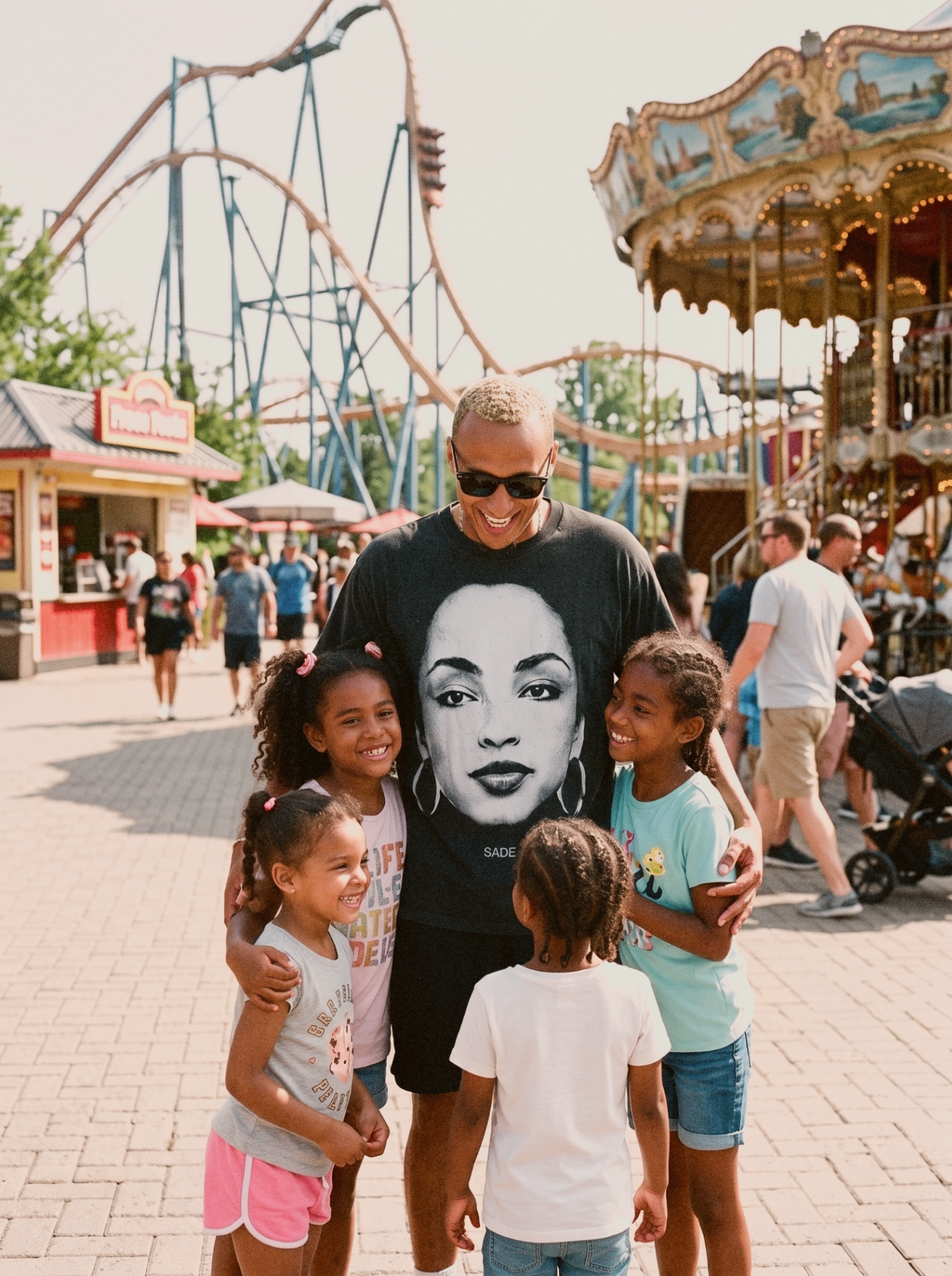 Robins Garden founder Riley Robbins sharing a joyful moment with four children at an amusement park.